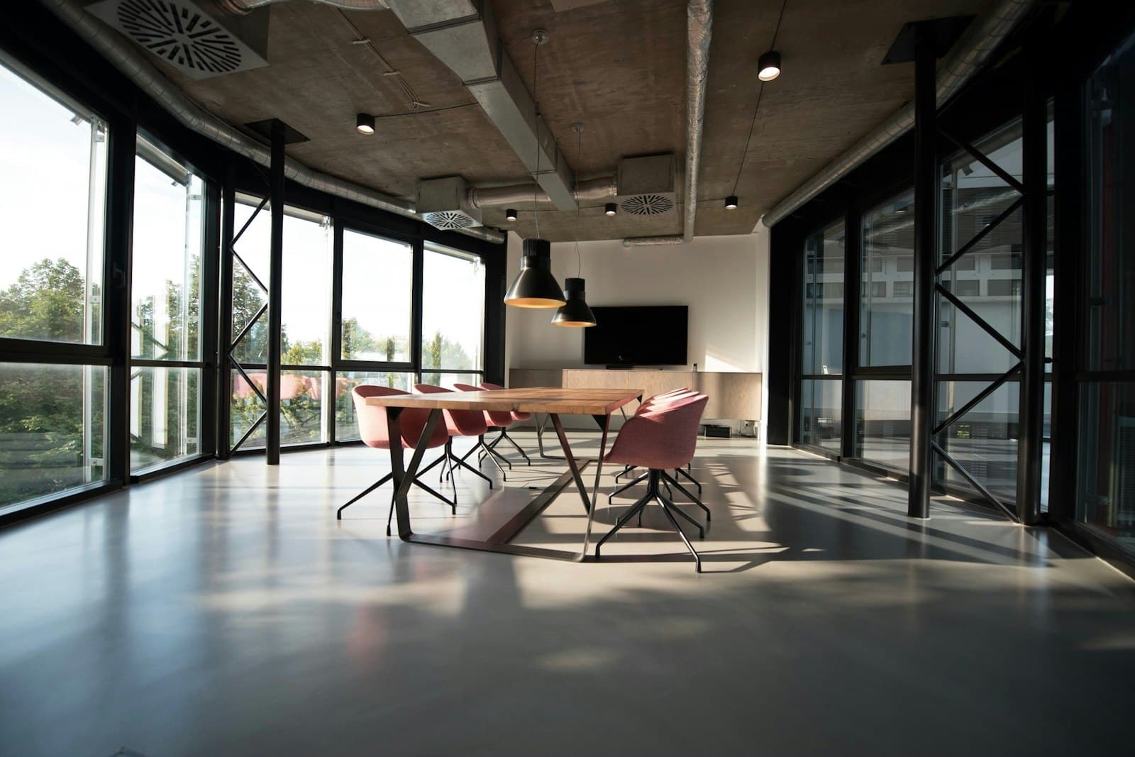 Glass-walled meeting room inside an office building
