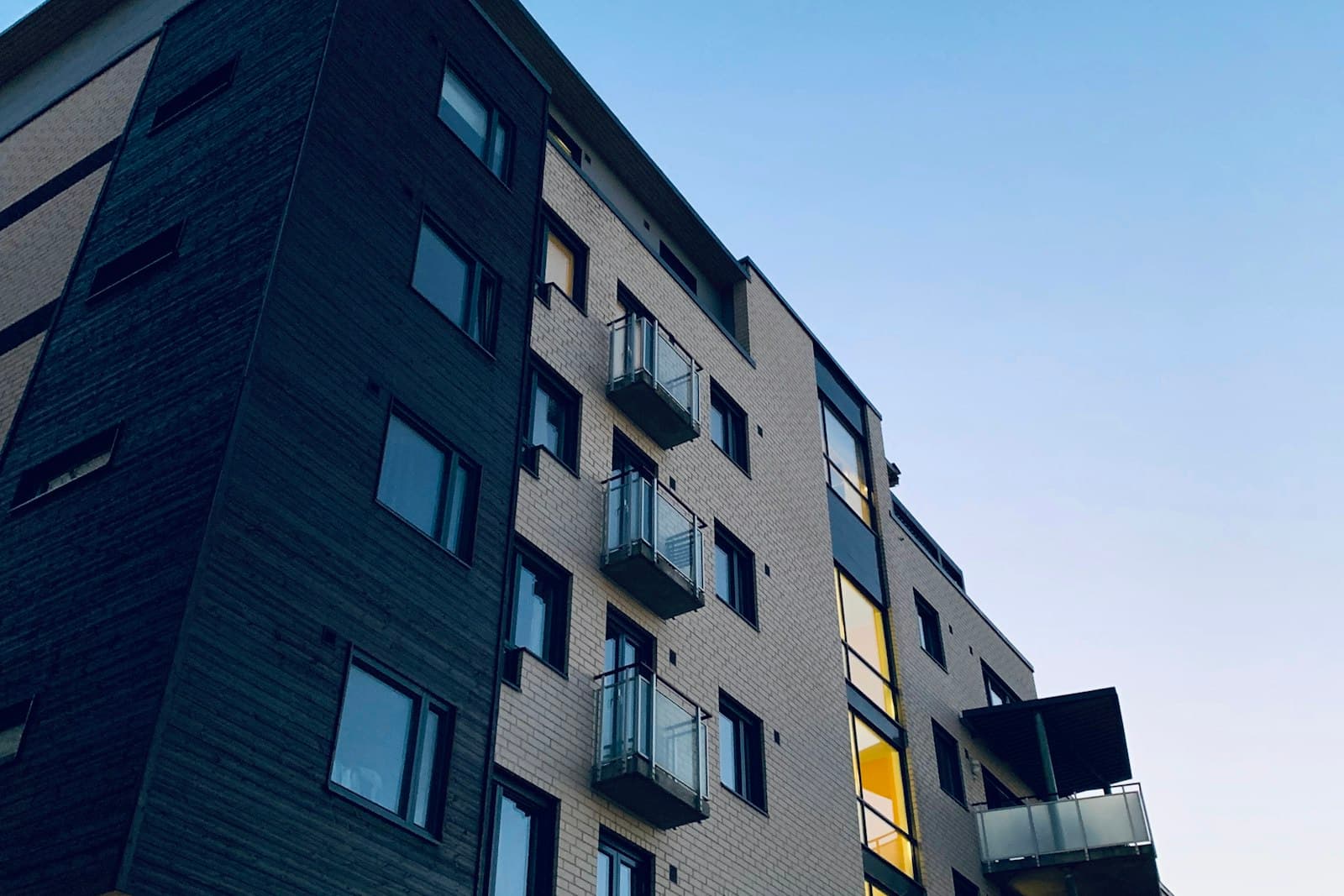 Brick and timber apartment building with balconies